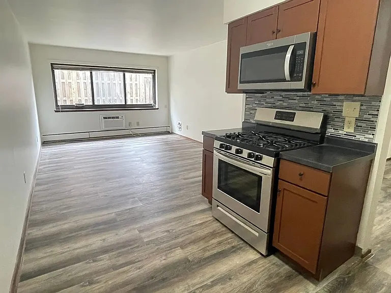 Step into the inviting interiors of LS Capital Group, featuring a spacious kitchen equipped with modern appliances and sleek finishes. Ideal for comfortable living, this space combines functionality with style. Schedule a tour today!