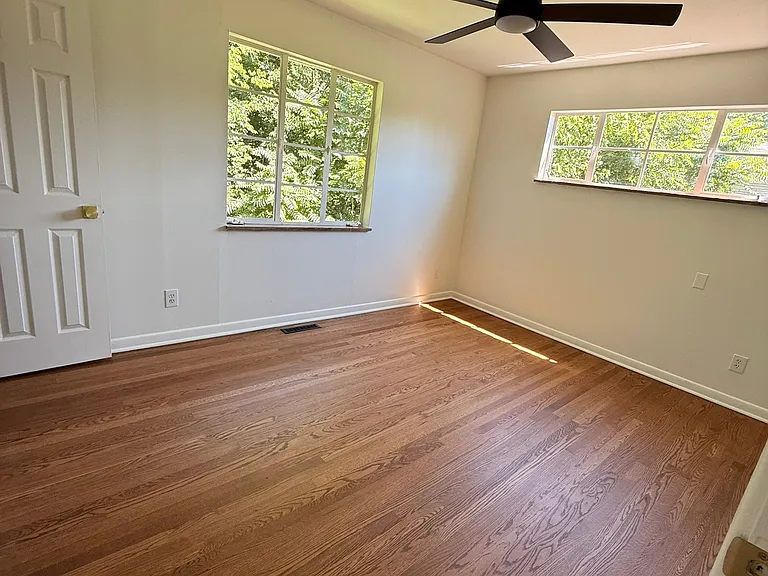Newly refinished solid hardwood floors throughout all 3 bedrooms, main living area and dining room.
