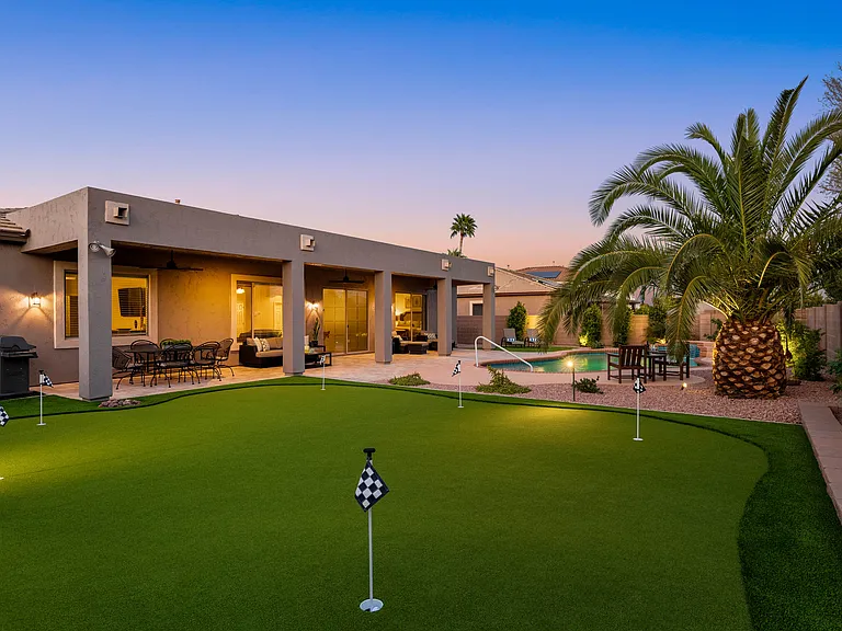 Our backyard putting green offers endless fun for all ages.