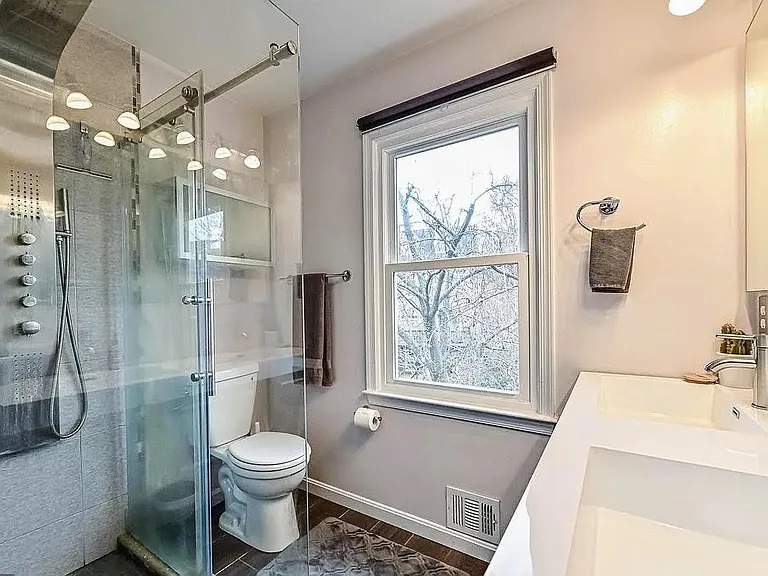 Primary En-suite Bathroom #1 w/ luxury rain shower, hand shower, and body sprays