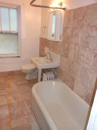 Large Bathrooms with new modern fixtures, marble tiles and extra large cast iron Tubs.