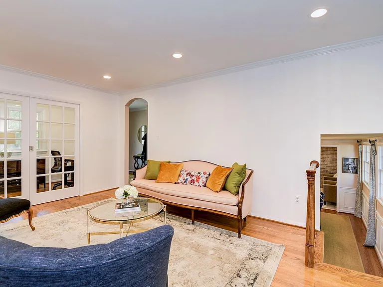 Living room on front door level. Office can be closed off with pocket french doors. Access to dining room creates circular flow.