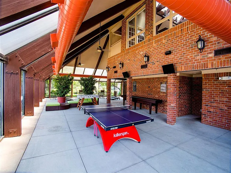 Entertainment lounge with a ping-pong table and shuffle board