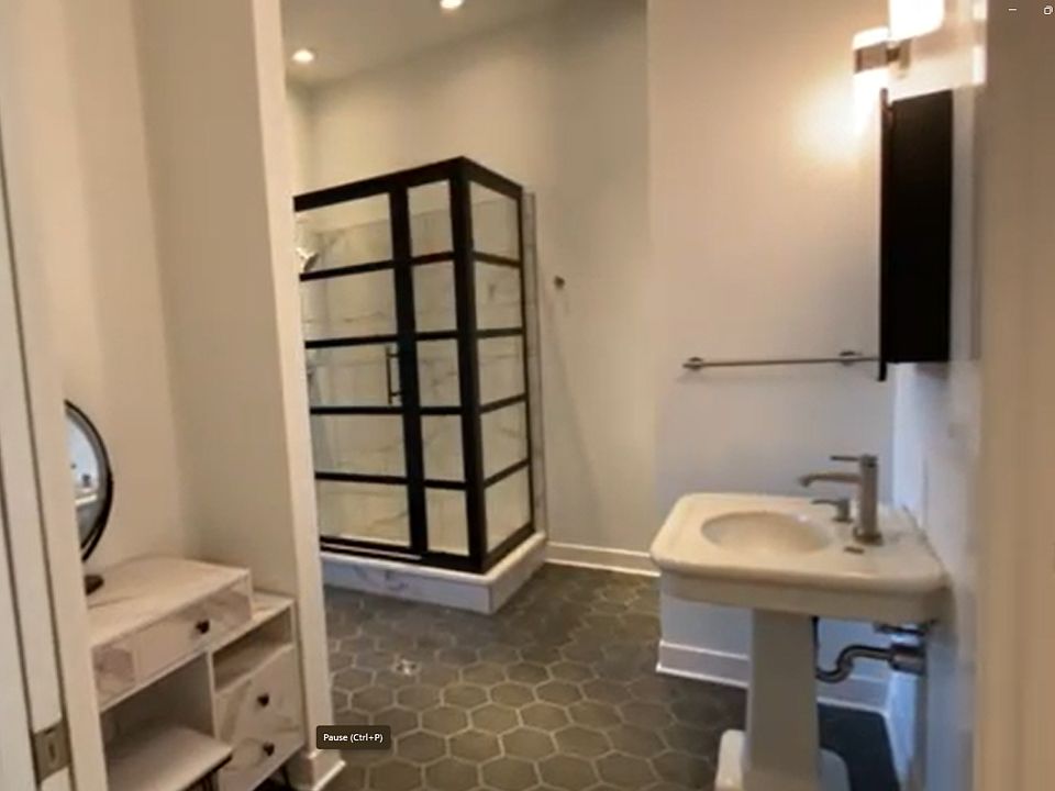 Jack & Jill style bathroom (shower only - no bathtub), and stackable laundry unit.