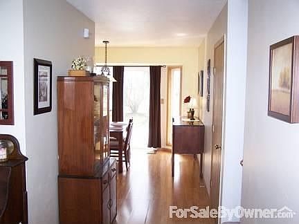 Main Hallway
						:
						view from front door, wood laminate floors throughout main level.