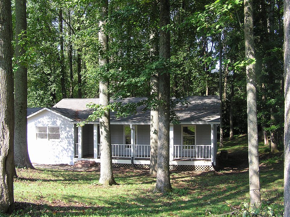 House from the street with wide front porch.