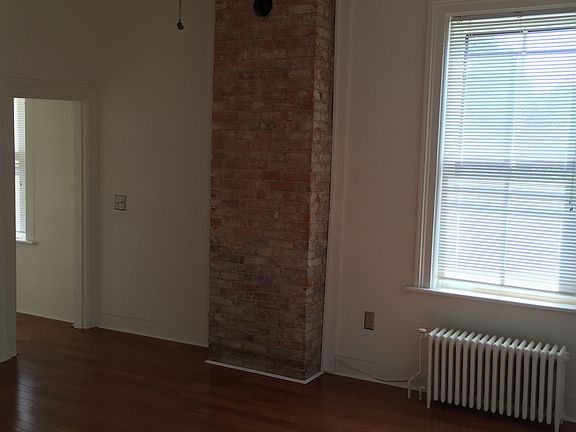 Living room with exposed brick