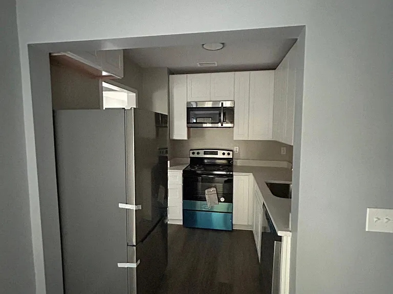 kitchen connected with laundry room
