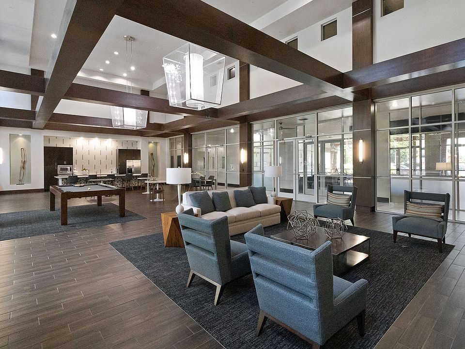 Expansive seating area with TV gallery located in resident game lounge