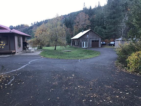 Large barn with partial access for tenant. 24x24ft space for tenant that includes garage access for a car.
