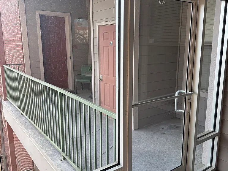 Entry to front balcony and property
