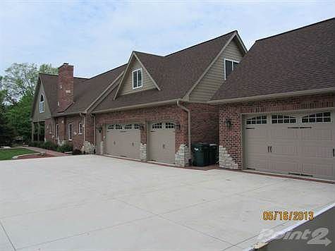 L-shaped home on a double wide lot