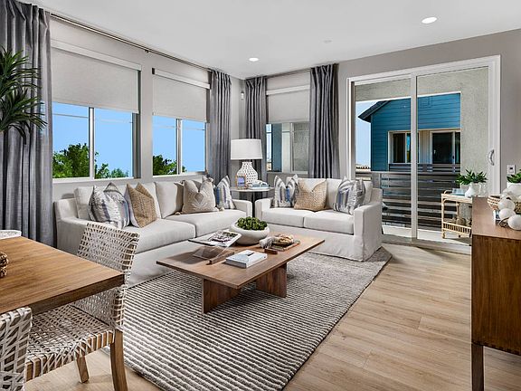 An image of the great room in the Plan 1 model home at Row.