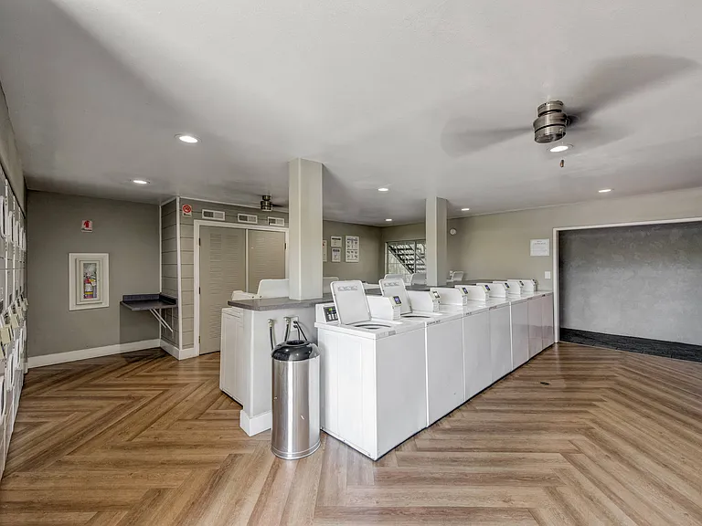 laundry room with washer and dryers