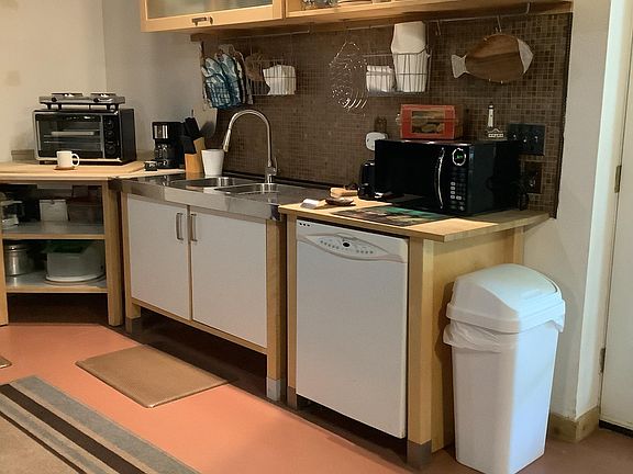 Stainless double sink and Maytag dishwasher. Pots and pans, stainless, and glassware also included.