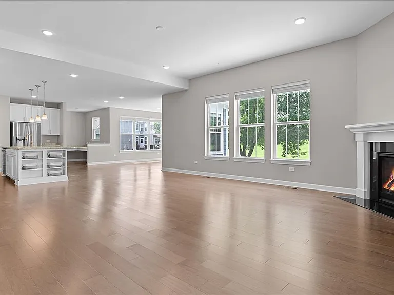 Open concept first floor with kitchen, dining room, and family room.