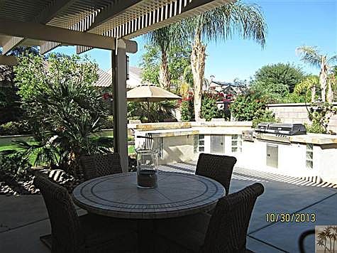 Outdoor dining under the extended covered patio and at the c