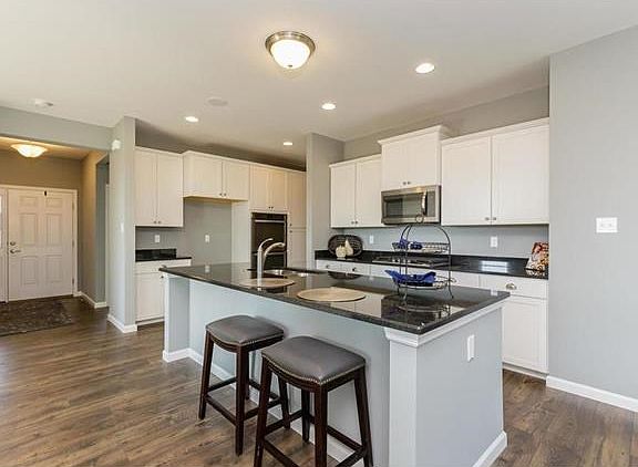 Kitchen with Large Center Island, Double Ovens, Gas Cooktop and Microwave