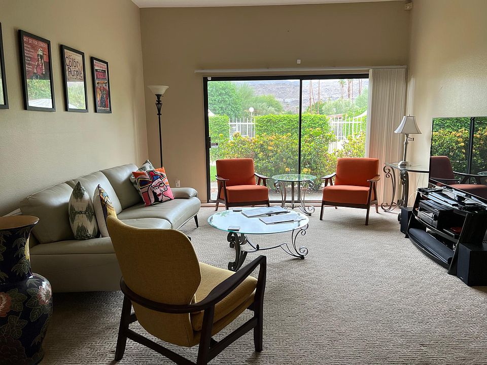 Living Room looking out to pool and mountain view.