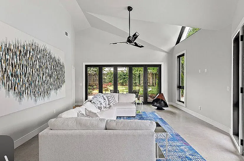 Beautiful family room with patio doors that open to a private backyard. - 373 Corral St