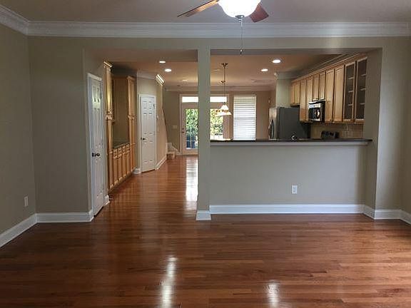 View of living, kitchen and dinning area, hardwood floor