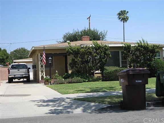 Long concrete driveway to (2) Car garage with roll up door and opener