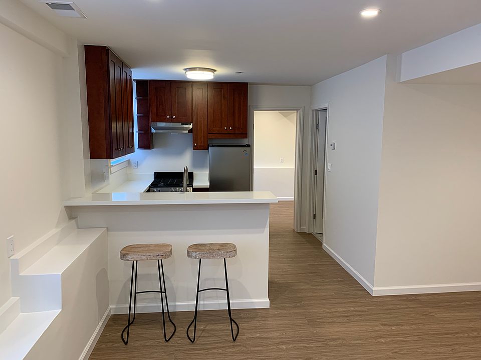 Living Area, Breakfast Bar and Kitchen