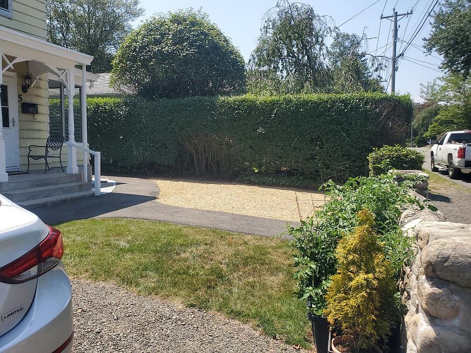 front yard (*hayed area has been seeded and will become grass.)
