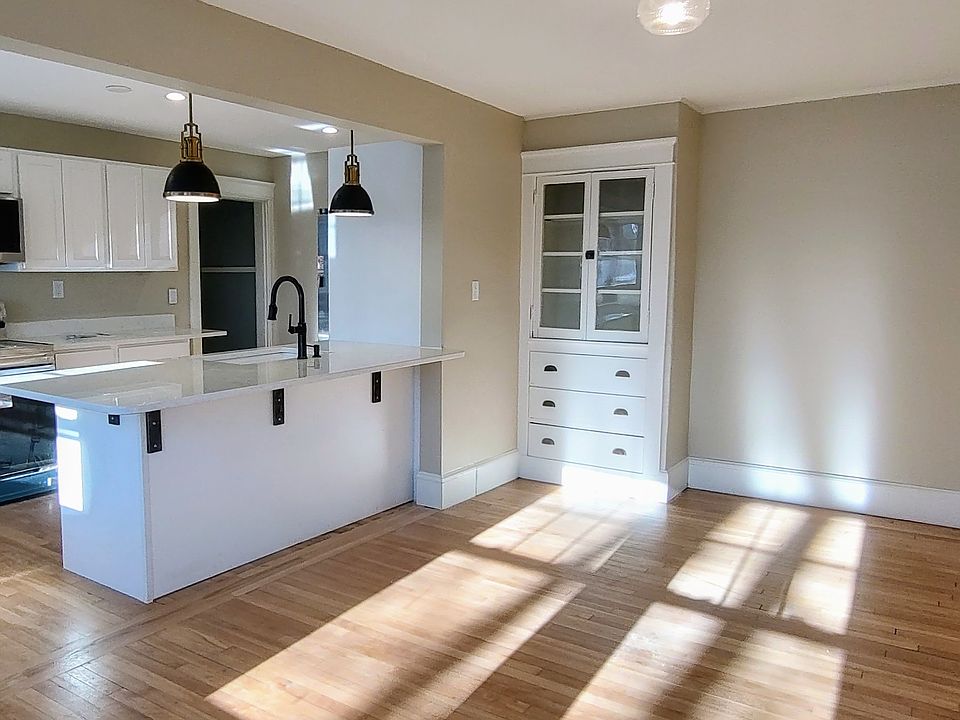This unit is so sunny! Spot the sweet built-in in the dining room.
