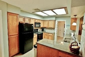 Recently updated Kitchen features granite counters. Fridge stays!