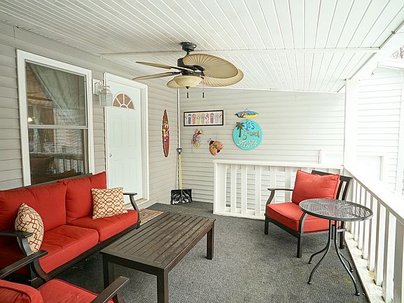 This charming front porch greets you and is the perfect spot for morning coffee as the hummingbirds and occasional deer wake with you.
