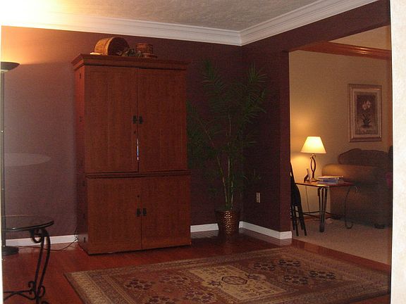 Gorgeous wood flooring in the living room will set of your finest rugs.