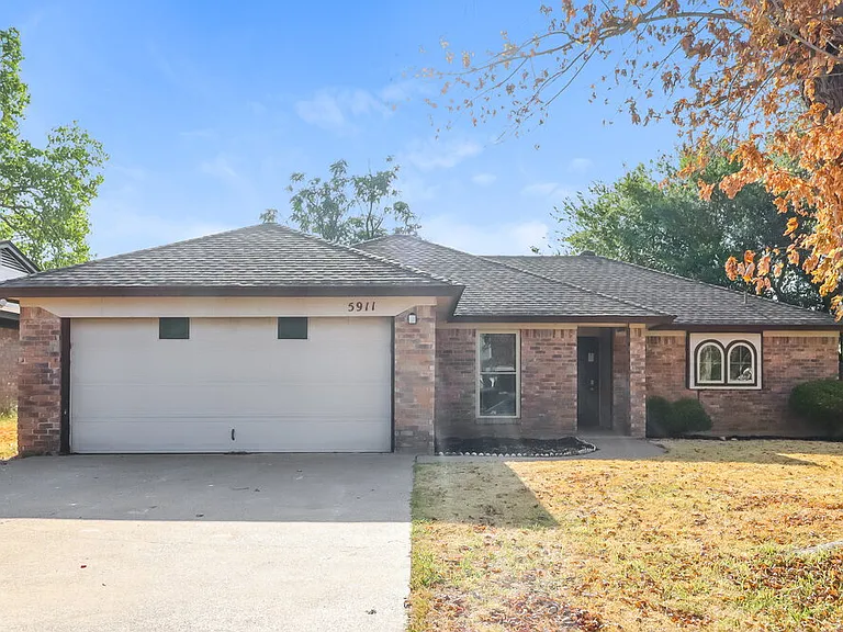 5911 Woodsetter Ln — Photo 1