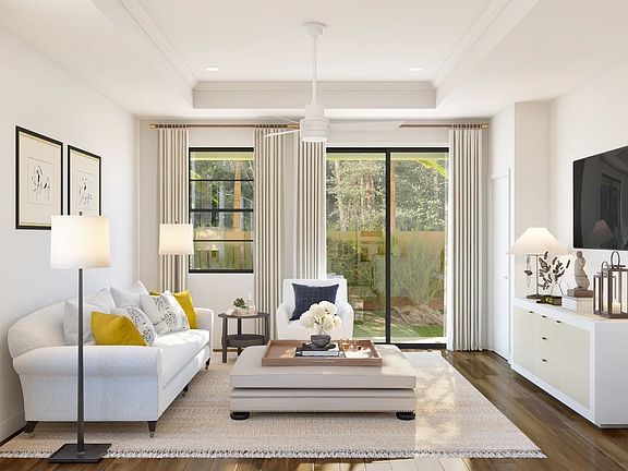 Great room with coffered ceiling and crown moulding