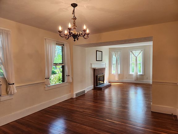 Formal dining room and living room with working fireplace