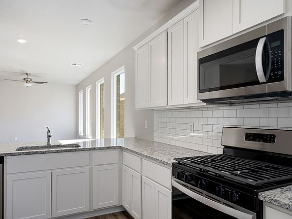 The kitchen of the Sudan has sprawling granite countertops.
