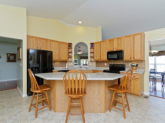 Great kitchen area with crescent island.