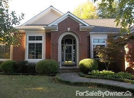 Manicured walkway leading to front entry