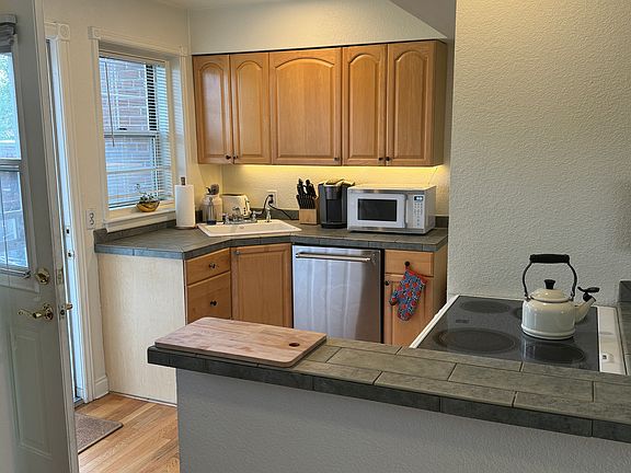 Kitchen with door to back patio