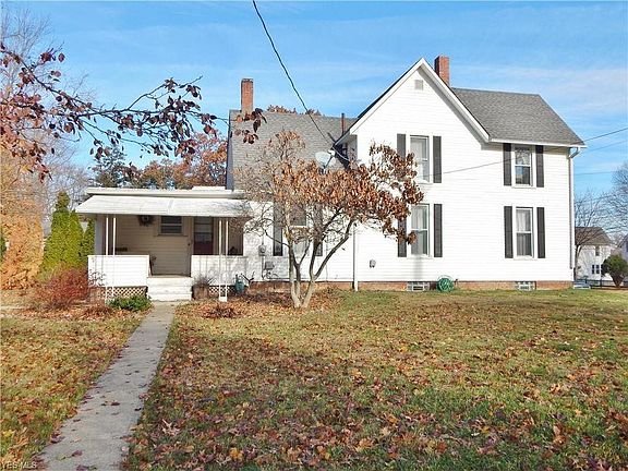 Side of the house with porch entrance into kitchen on Grant street