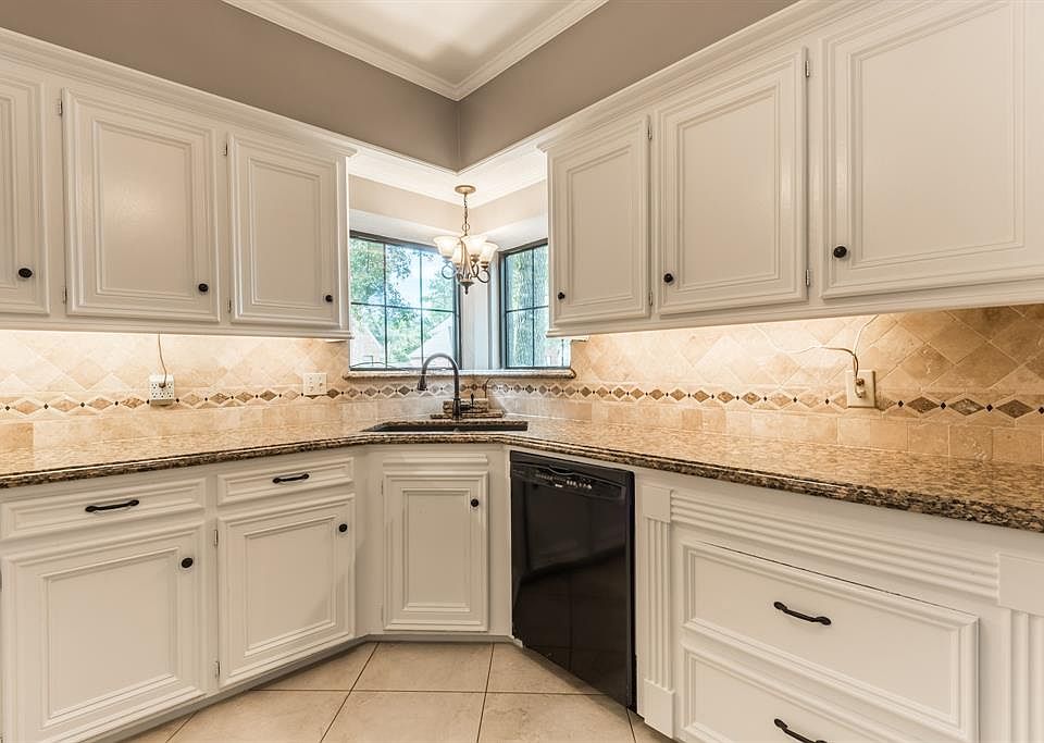 Welcome to your new kitchen!! These newly painted Sherwin Williams crisp white cabinets (09/2018) and contrasting gray walls are truly stunning. These custom solid wood cabinets are as striking in person as they are in this photo. Granite countertop,