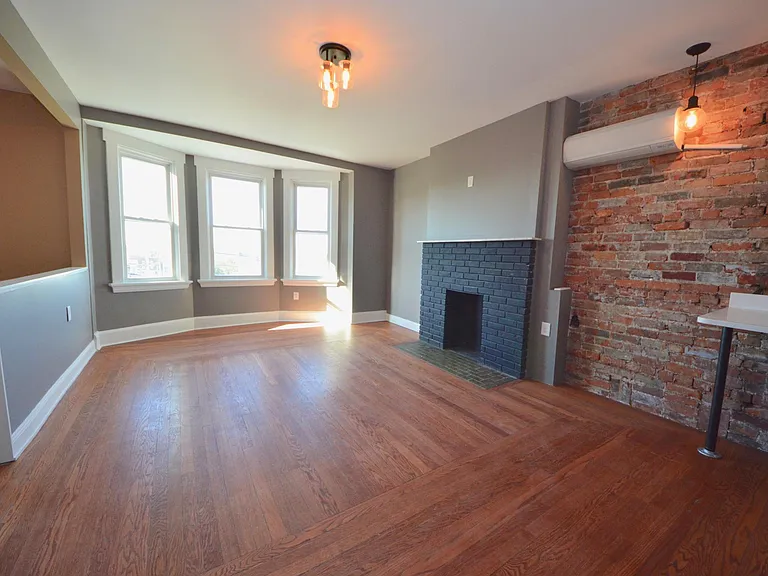Living room, open concept to kitchen and dining room.