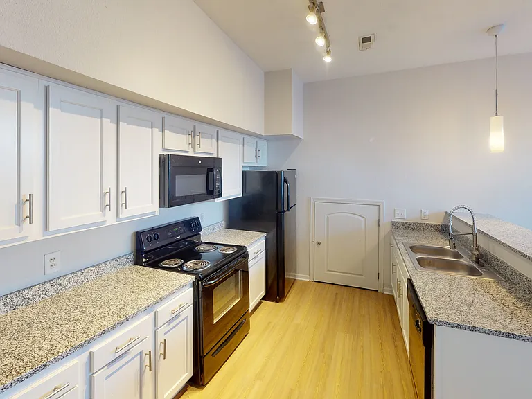 Modern Kitchen with Granite Countertops at Ralston Apartments in Downtown Indianapolis