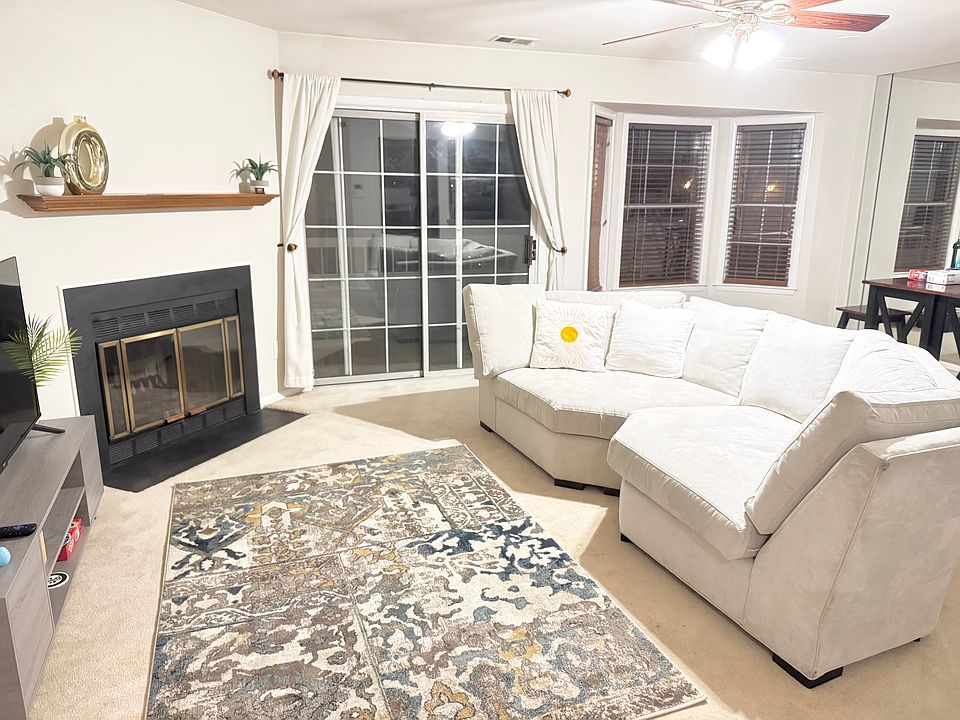 Large living area with adjacent dining area and deck outside