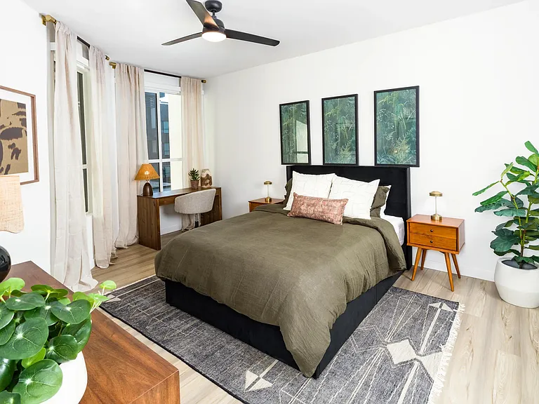 A calming primary bedroom at Modera Higley Commons, featuring soft natural light, refined finishes, and a layout designed for everyday comfort.