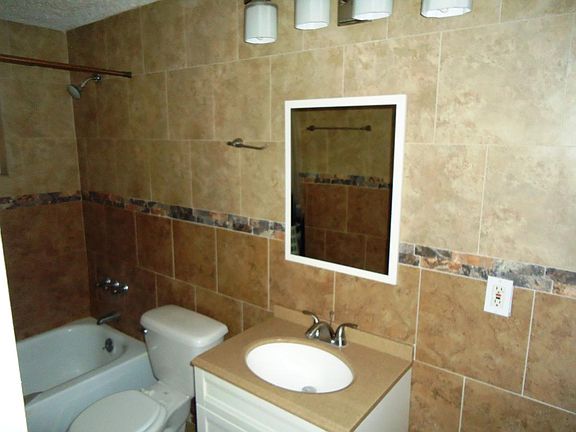 Custom Tile from Floor to Ceiling