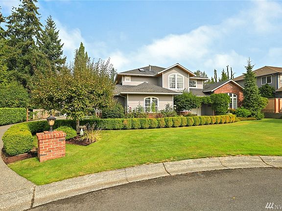 Plum Tree, Berry Bushes, Garden Spaces, Well Established Landscaping accent this Gorgeous Home!