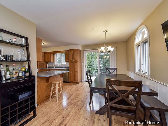 Sliding glass doors off of the Dining area take you out to the brick paver patio and fenced yard