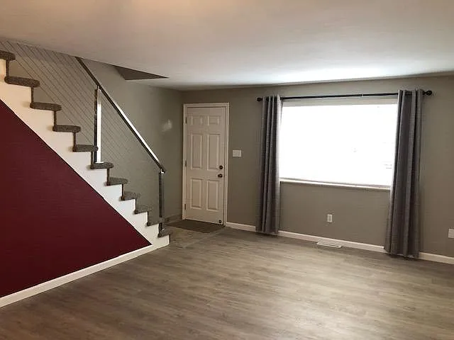 Front entry to Living Room/Dining Room has all new paint and flooring.