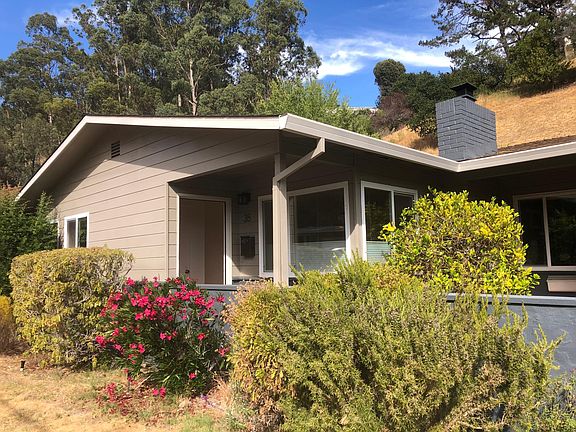 38 Elizabeth Way is a an end unit of the triplex. Drought is leaving the yard not quite so lovely as it has been....